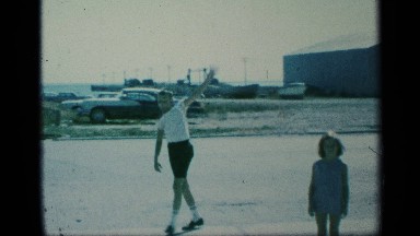 1959: a boy shows signs while walking forward NEW YORK
