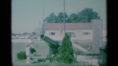 1959: Two Children Playing Around a Military Statue of Cannons in New York