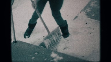 1959: a women clean the snow ice need for road use of the steel tool morning