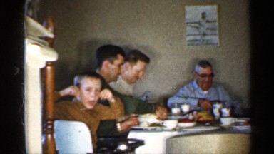 1959: one family eat for the food in table sit in the bench back side wall photo