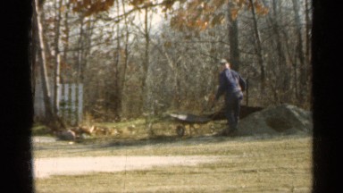 1959: Ambitious Man Spreading Topsoil in Yard, Indiana