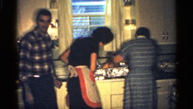 1959: a family in the kitchen preparing dinner. INDIANA