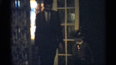 1959: father and son playing in the home, with the son playing the role