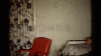 1959: a lady reading to the newspaper with enjoyment the home. INDIANA