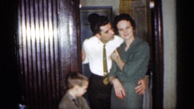 1959: a beautiful couple is shown the men kiss the the girl and the child