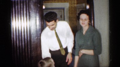 1959: mother, father, and son playing around inside the house INDIANA