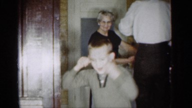 1959: three people stand in a room and they are all doing different things