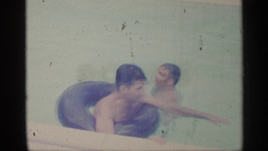 1959: two teenage boys play in an in ground swimming pool INDIANA