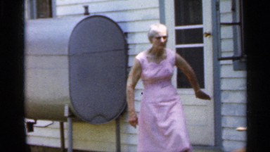 1959: a old lady come out from the house and close the door and see back