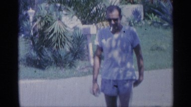 1959: a men and women walking the road the men smoking the women face to fix