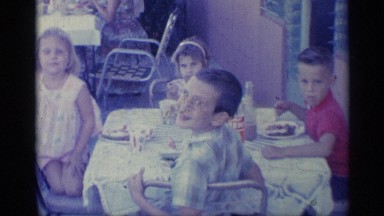1959: kids and more people are sitting at the outdoor restaurant in the morning