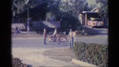 1959: kids riding their bikes through the neighborhood INDIANA
