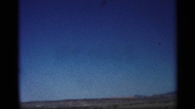 1959: the slow drive the car view the mountain and follow the lorry in the road