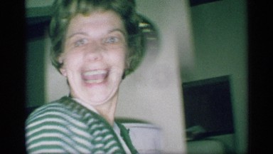 1959: Woman Opens Mouth and Responds While Turning Around in Living Room