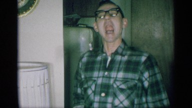 1959: laughing man opens mouth and goofs off for the camera NEW YORK