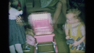 1959: interior with adult and children and gifts and christmas tree. NEW YORK
