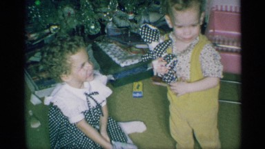 1959: kid playing and enjoying in her home around with her two kids NEW YORK