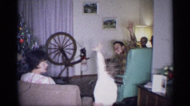1959: family members wave at the camera during a christmas gathering. NEW YORK