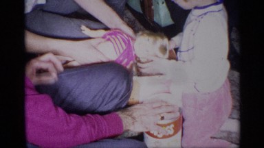 1959: a little girl unpacking and playing with a doll NEW YORK