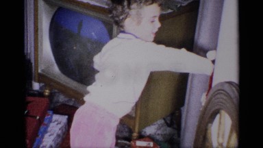 1959: a child unwrapping toys on christmas NEW YORK