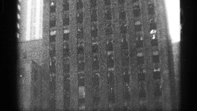 1959: overview of multi-storied edifice, as camera pans up to top of building.
