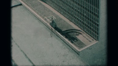 1959: on top of another building, video-graphed zooms into the roof of another
