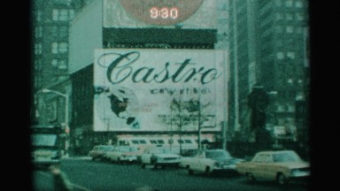 1959: a large sign that is located in a city. NEW YORK