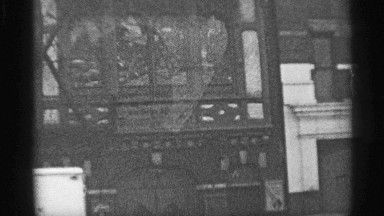 1959: the building are near the road, vintage clip