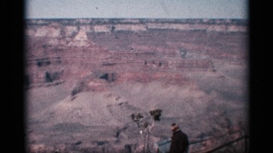 1959: Men Women and Child Watch Nature View from Top Angle Near Hills in Arizona