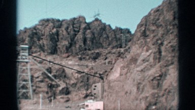 1959: a dig mountain area brownish in color having some steel work on it