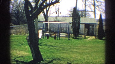 1959: children with a swingset in a yard ARIZONA