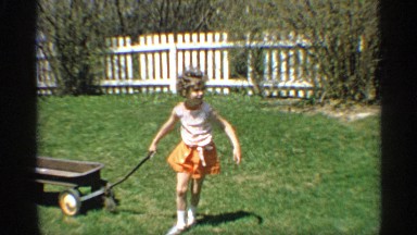 1959: the girl play with a toy and she go to meet her dad and say something