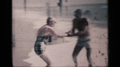 1959: a couple playing at the place of a river and enjoying their vacation