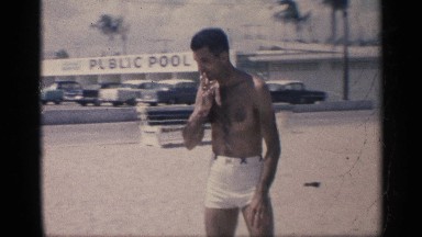 1959: a man ready to swim nearby the beach. CALIFORNIA