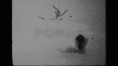 1959: boy loses balance after standing up in shallow water holding goggles
