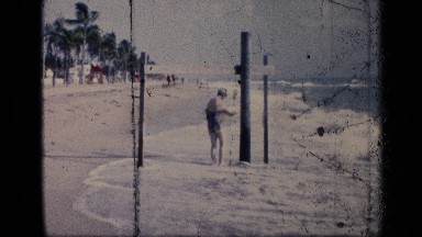 1959: woman and kid on the beach near pylon. CALIFORNIA