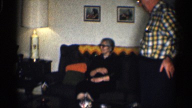 1959: two old couples where one of them is sitting in sofa