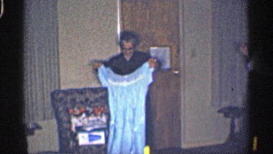 1959: cute mom taking her daughters clothes to wash in her hands and mom shows