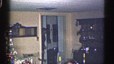 1959: woman walks into the living room and starts dancing. CALIFORNIA