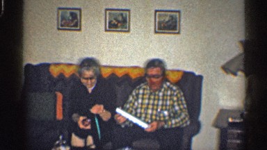 1959: two old couples sitting in a soft and checking the things