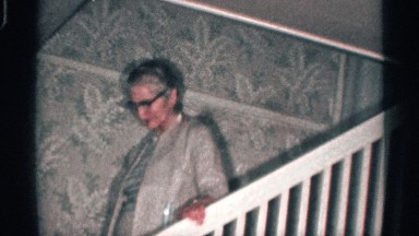 1959: Older Lady Coming Down the Stairs California