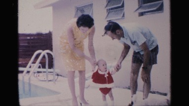 1959: mother and father taking their daughter to swimming pool