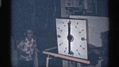 1959: kid playing and enjoying in her home with her clock plays FLORIDA
