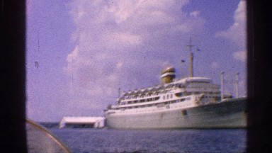 1959: a big ship on the river and the sky looking good at the morning time.