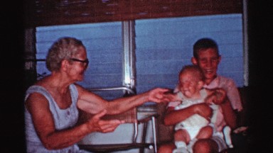 1959: kid playing and enjoying in her home with her grandma and grandpa FLORIDA
