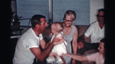 1959: a cute family sitting at the floor and taking care of their kids