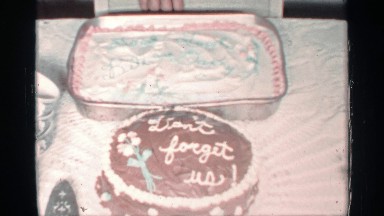 1959: two cakes, one round, one rectangle with writing on them