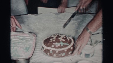 1959: two men hold knives and cut decorated cakes as others watch them FLORIDA