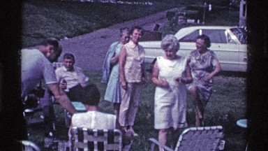 1969: many of the people sit and talk moreover some of the people still standing