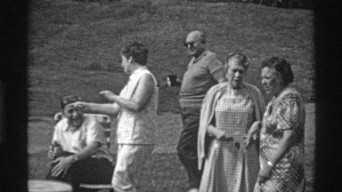 1969: Men and Women Sit in Garden Center at Morning